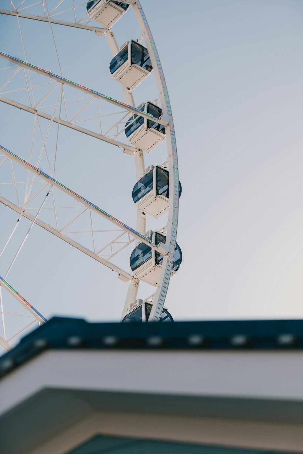 a large ferris wheel on top of a building