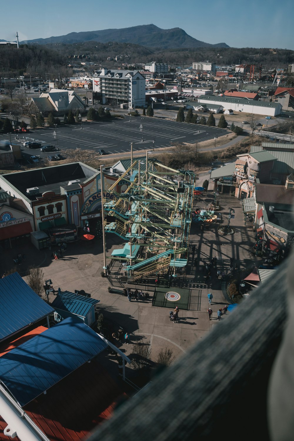 an aerial view of an amusement park in a city