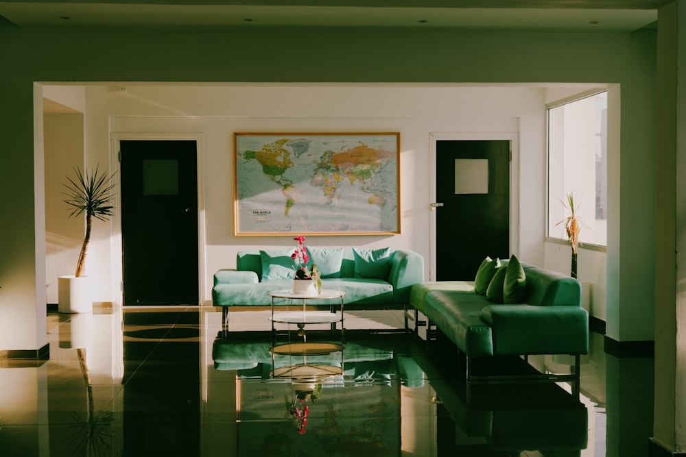 a living room filled with furniture and a painting on the wall