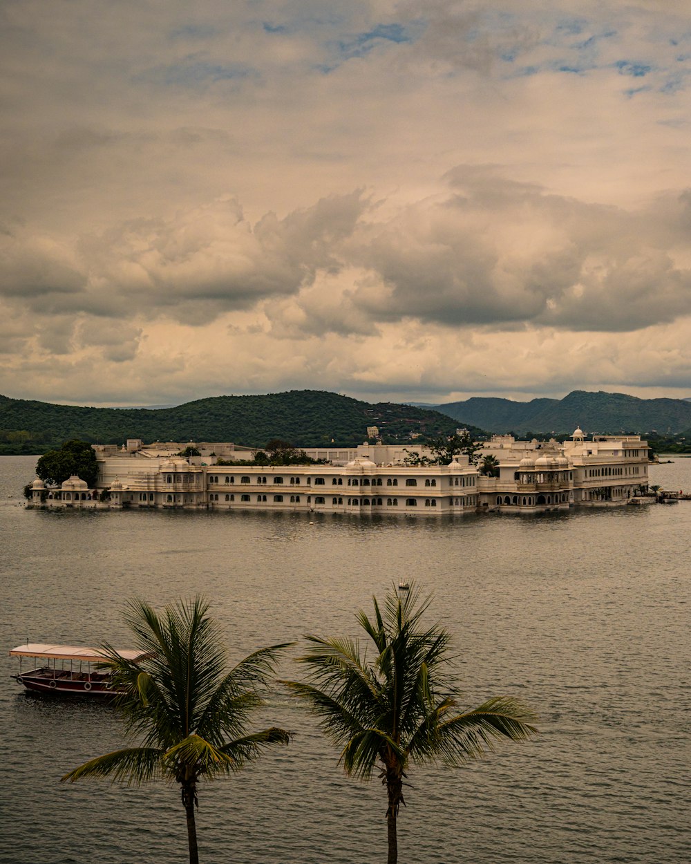 a large building sitting on top of a large body of water