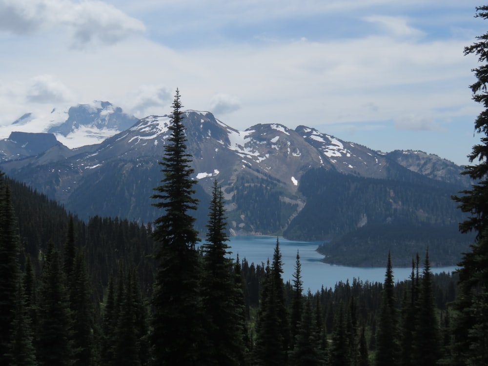 a view of a mountain range with a lake in the foreground