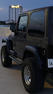 The Onyx Coffee Jeep at sunset, lights glowing softly as the day winds down.