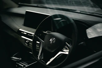 a steering wheel and dashboard of a car