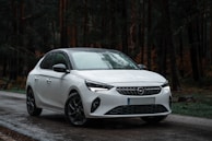 a white car parked on the side of a road