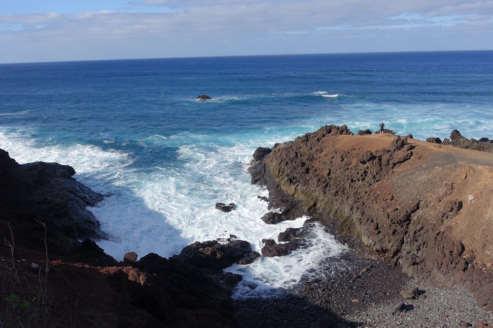 a view of the ocean from the top of a cliff