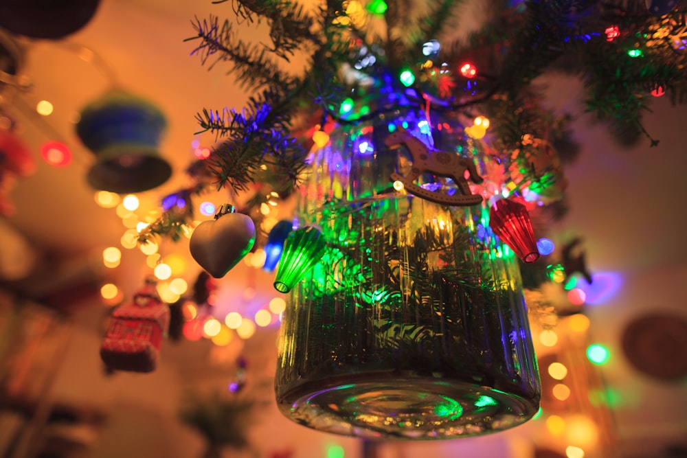 a close up of a christmas ornament hanging from a tree