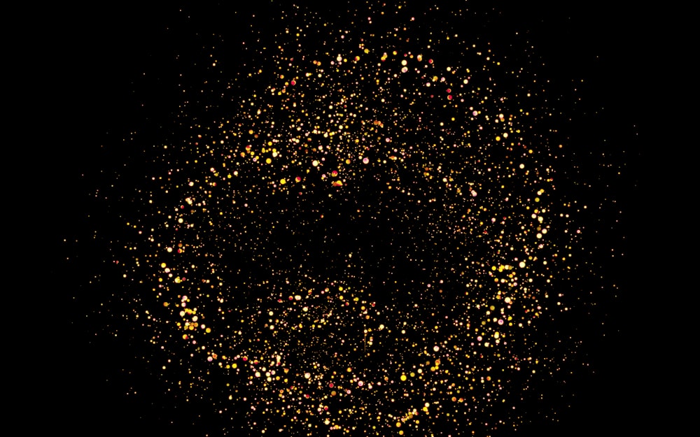 a black background with yellow and red speckles