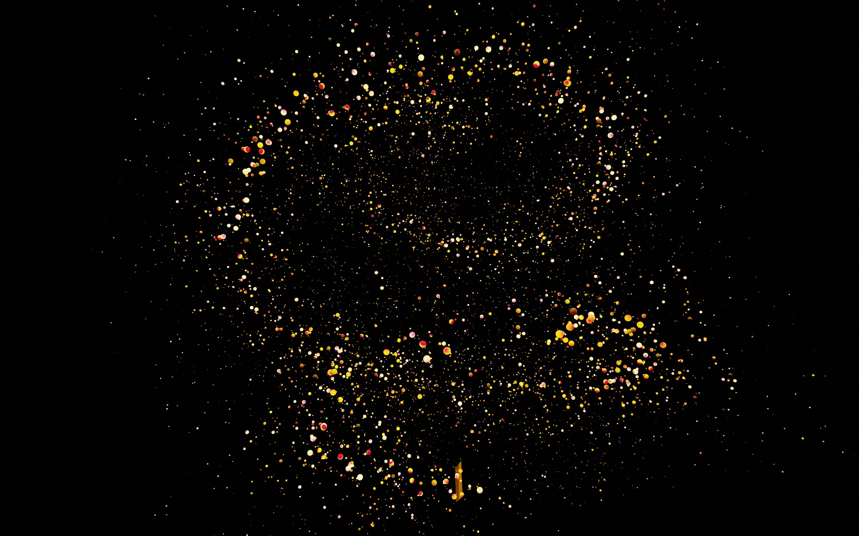 a black background with yellow and red speckles