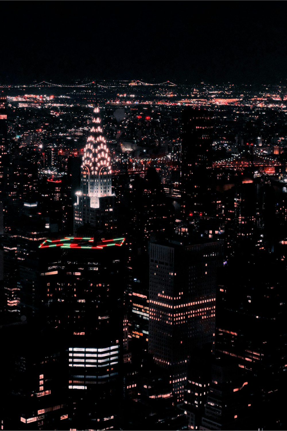 a view of a city at night from the top of a building