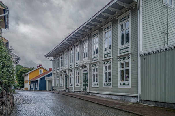 Old cobblestone street lined with colorful traditional houses