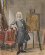 An 18th-century artist stands in a studio, holding a palette and brush, beside an easel with a partially completed painting of an architectural scene. The room contains a classical bust and an ornate draped chair.