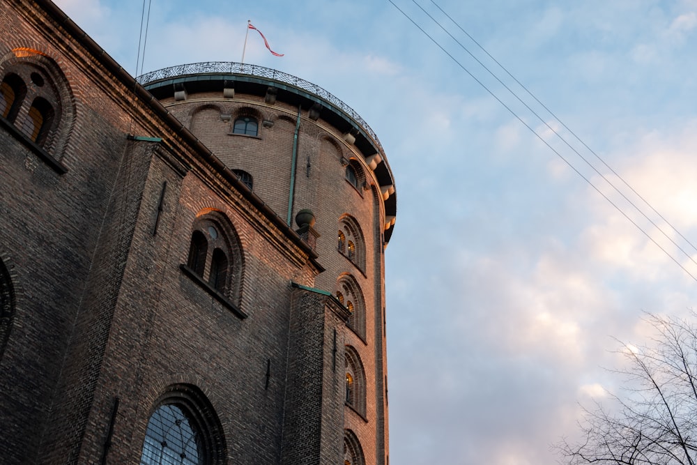 a tall tower with a clock on the top of it