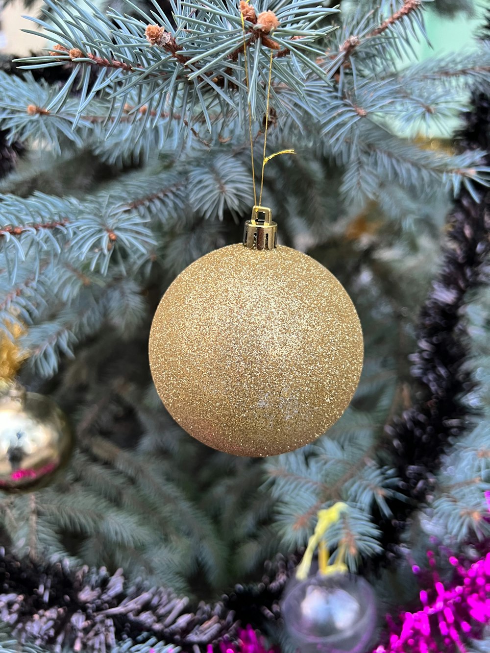 a close up of a christmas tree with ornaments