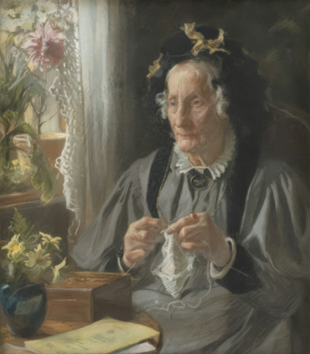 a painting of a woman sitting at a desk