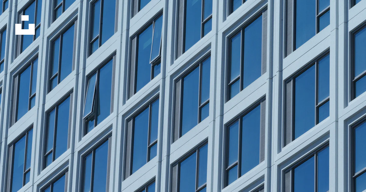 A close up of a building with many windows photo – Free Windows Image ...