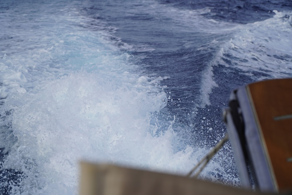 a view of the back of a boat in the ocean