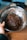 Close-up of hands mixing chocolate ingredients in a bowl.