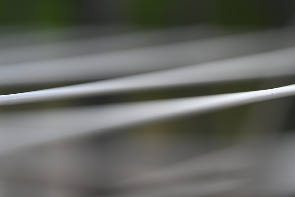 a close up of a white wire with a blurry background