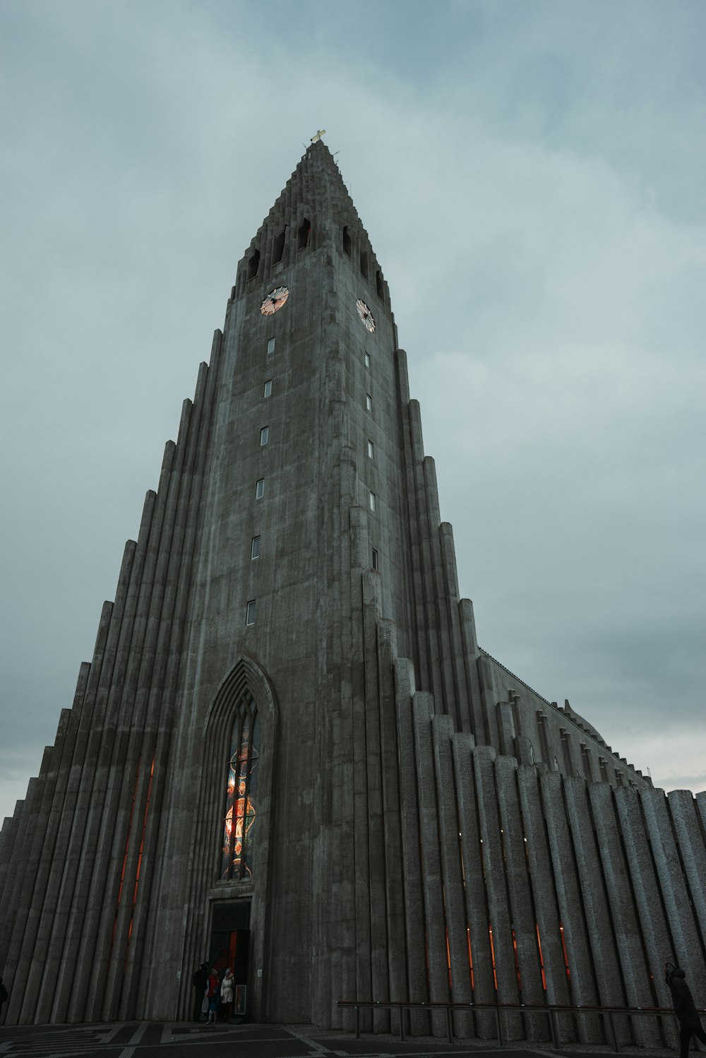 a very tall building with a clock on it's side