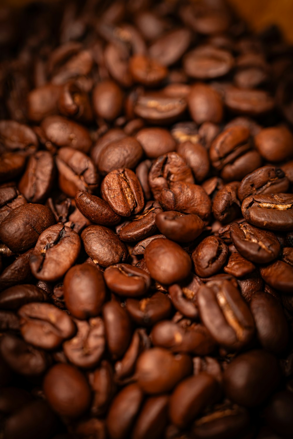 a pile of coffee beans sitting on top of a table