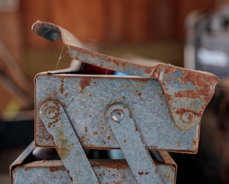 a rusted metal object sitting on top of a table