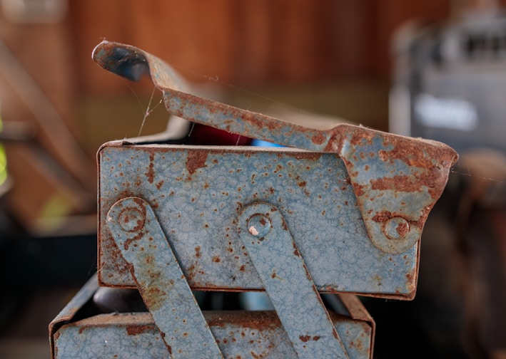 a rusted metal object sitting on top of a table
