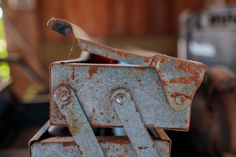 a rusted metal object sitting on top of a table