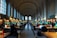 A focused student studying quietly at a desk in Silent Hall Library.