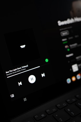 Image showing an Android device displaying a sleek music player app interface