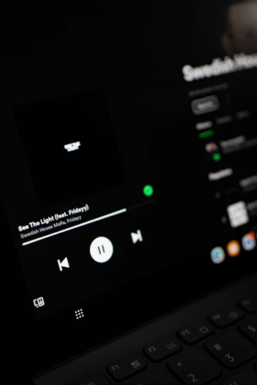 A sleek, modern video player interface glowing softly against a dark background.