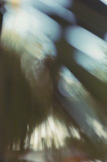 Abstract digital art with layered gradients and motion blur in deep gray and bright accent colors.