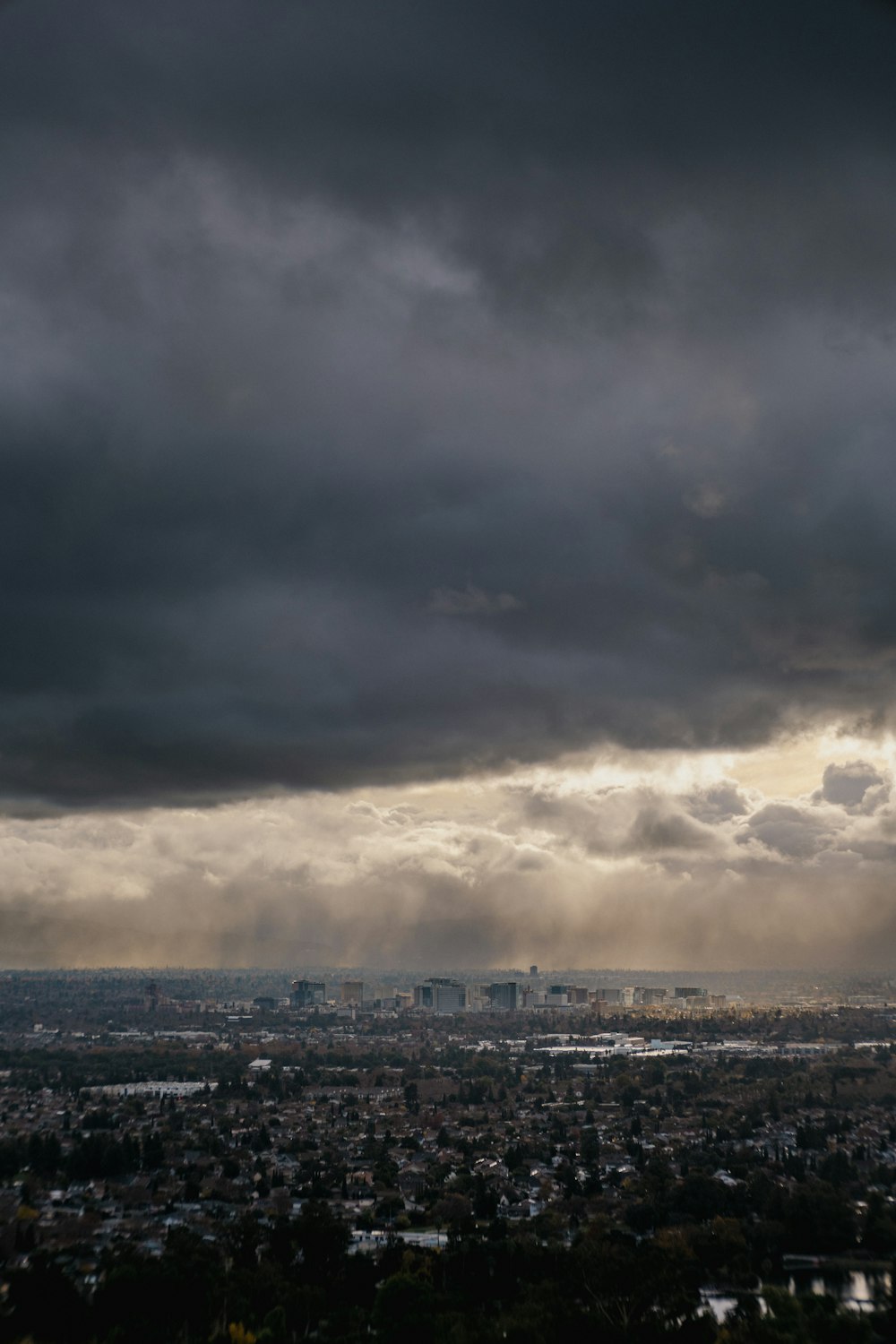 a view of a city under a cloudy sky