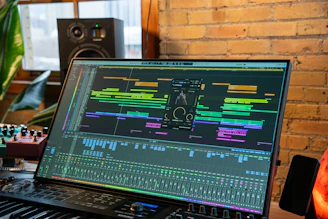 a laptop computer sitting on top of a keyboard