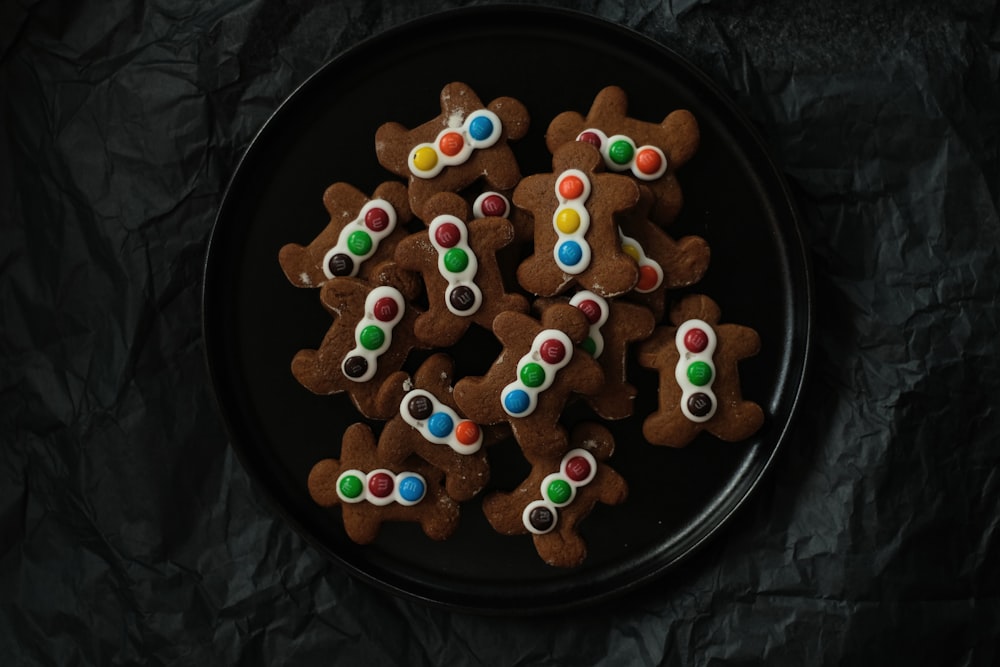 a plate of decorated cookies on a table