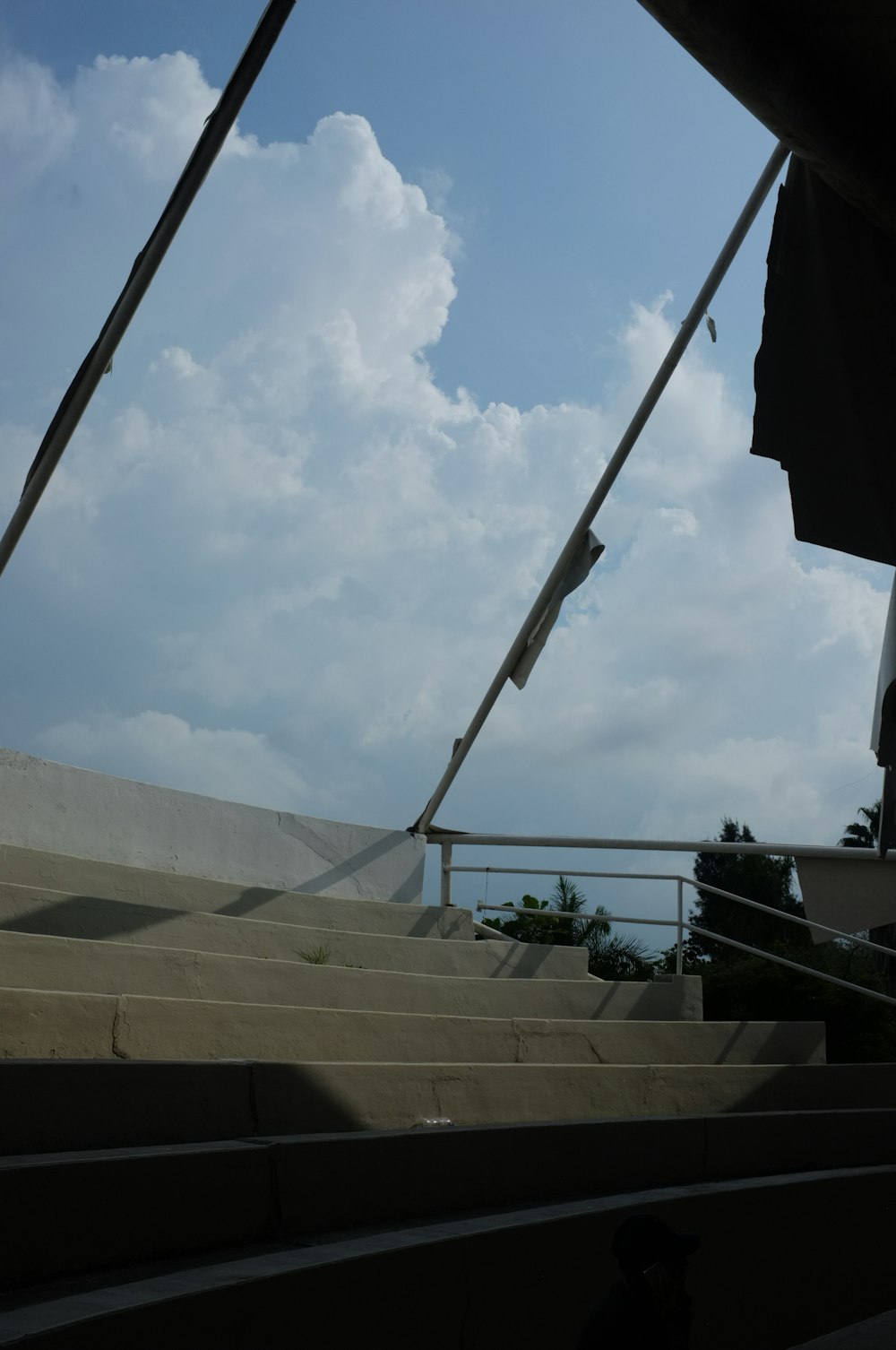 a view of some stairs and a sky with clouds