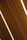 Several dark wooden panels are aligned diagonally with narrow strips of bright white lighting in between them, creating a sleek and modern appearance.