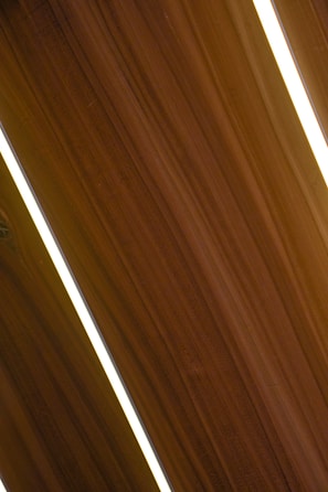 Close-up of sleek plywood panels arranged neatly in a modern kitchen setting.
