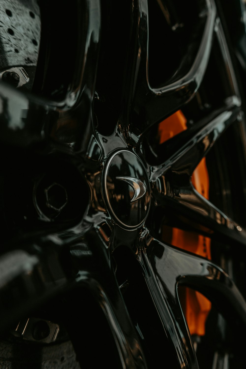 a close up of a black and orange wheel