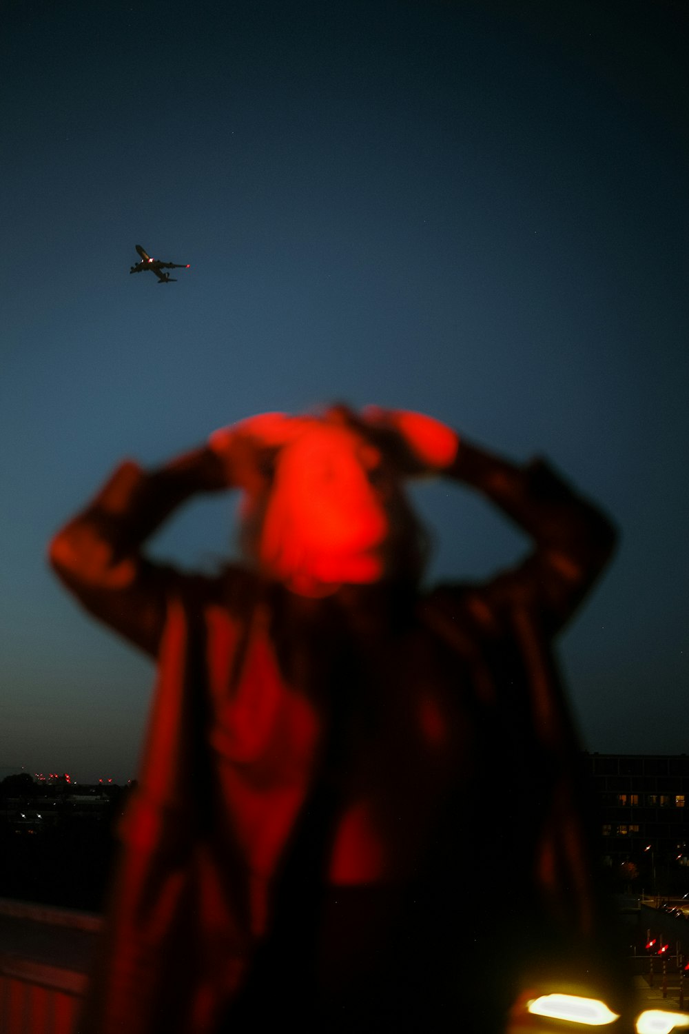 a blurry photo of a person looking at an airplane