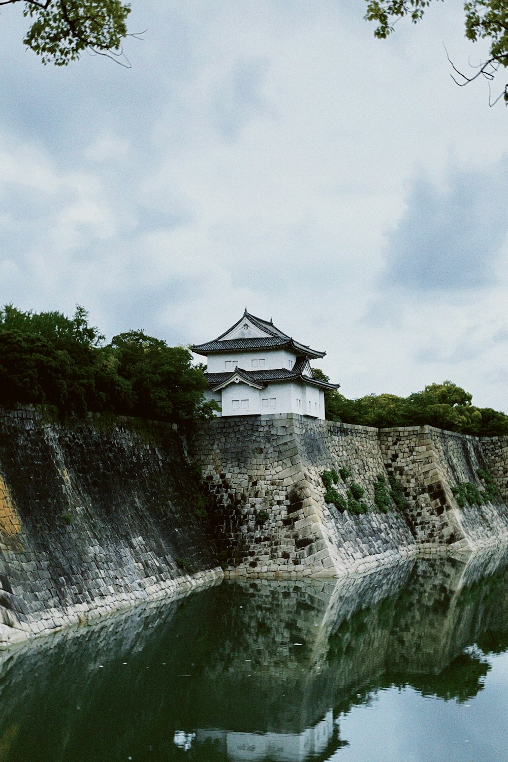 a large body of water with a building on top of it