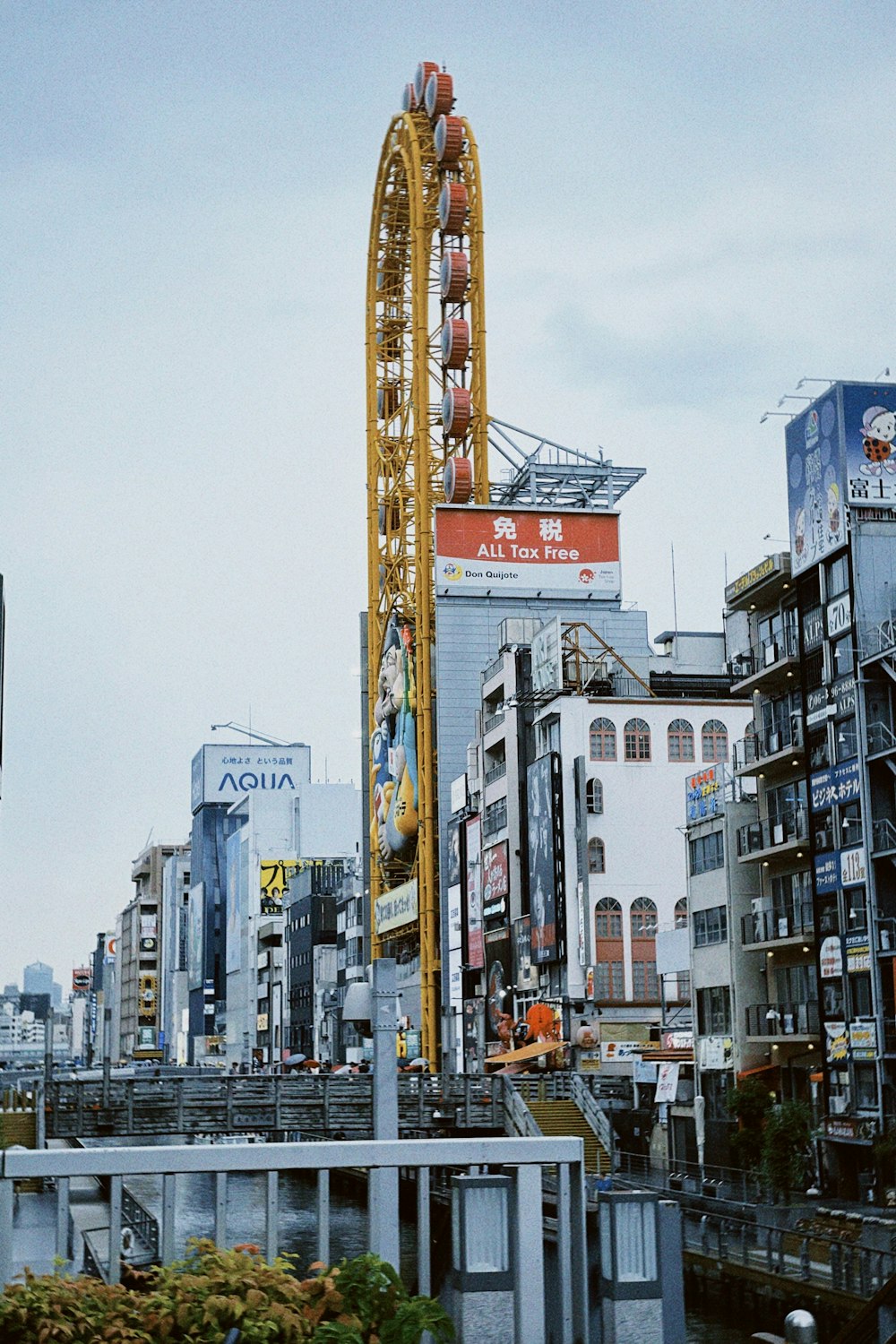 a roller coaster in the middle of a city