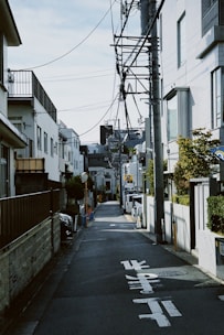 an empty street with a telephone pole above it