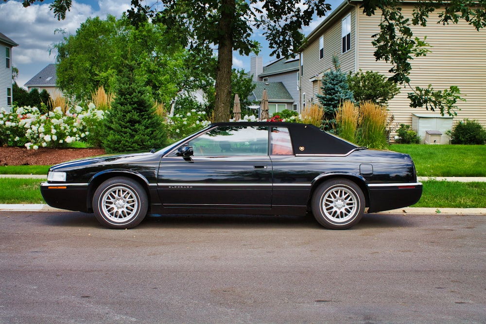 a black sports car parked on the side of the road