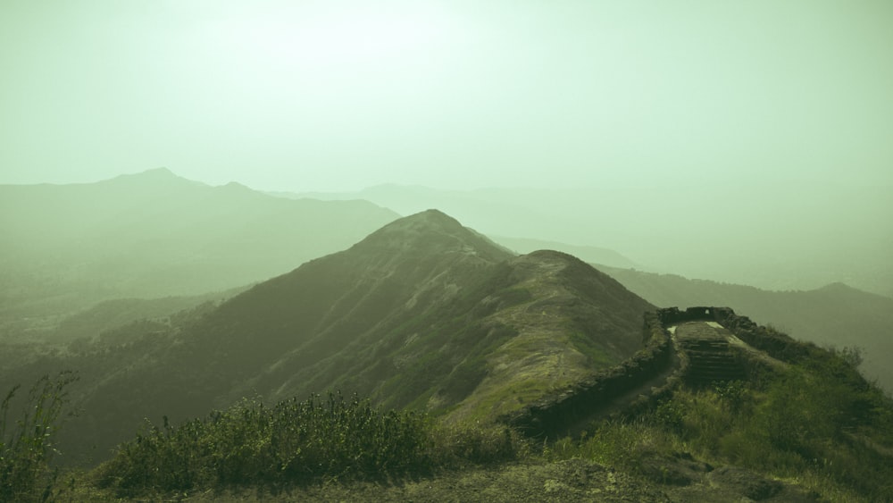 a view of a mountain with a path going up it