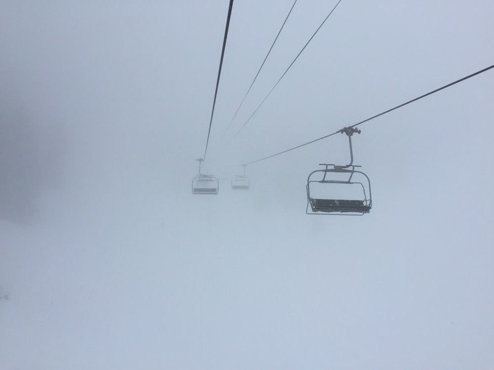 a ski lift in the middle of a snow storm