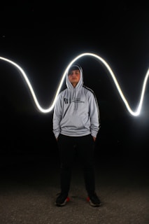 A comic book style illustration of a light gray hoodie with thick black borders and rounded edges.