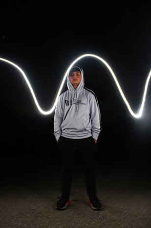 A comic book style illustration of a light gray hoodie with thick black borders and rounded edges.