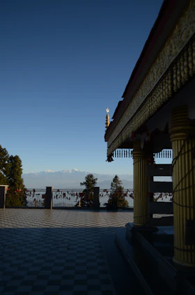 A serene photo of a temple courtyard bathed in soft morning light, inviting peace and reflection.