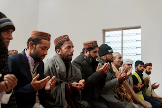 Hands joined in prayer during a warm church group meeting.