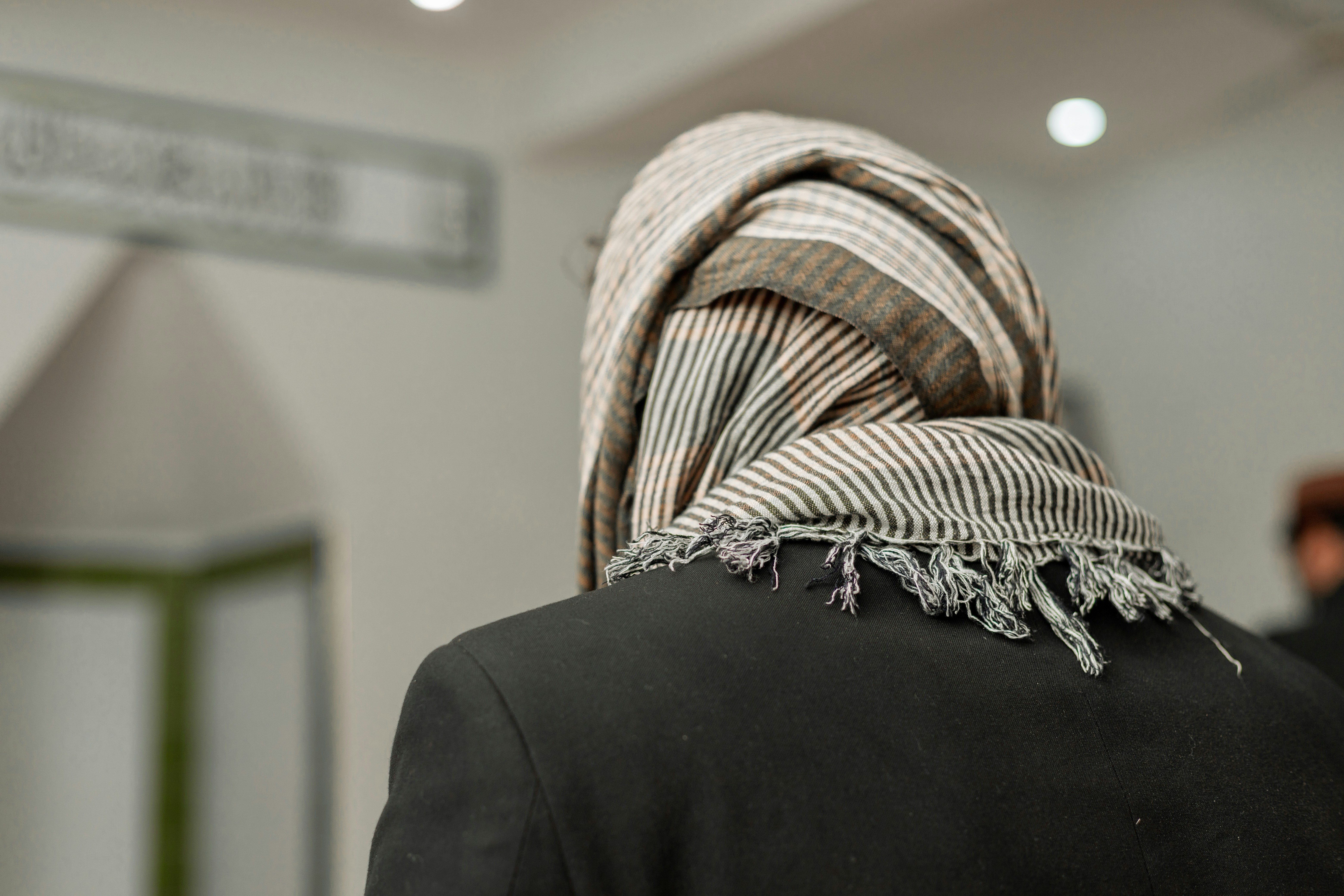 a person with a scarf on their head
